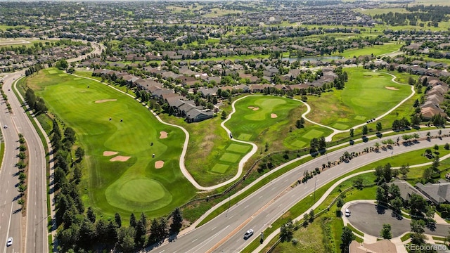 7713 S Zante Ct, Aurora, CO 80016 - aerial view of property and surrounding area with nearby suburban area, a large body of water, and a golf course