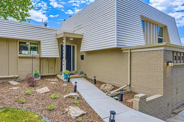 3378 Mowry Pl, Westminster, CO 80031 - entrance to property with brick siding and an attached garage