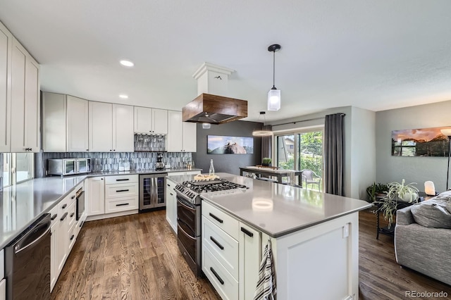 3378 Mowry Pl, Westminster, CO 80031 - kitchen with beverage cooler, appliances with stainless steel finishes, dark wood finished floors, a kitchen island, and recessed lighting