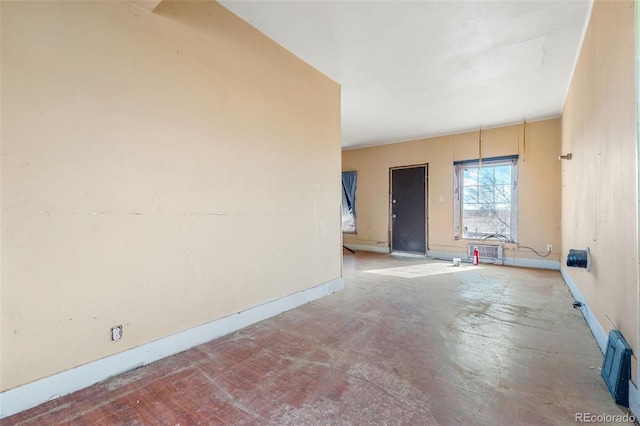 empty room featuring baseboards