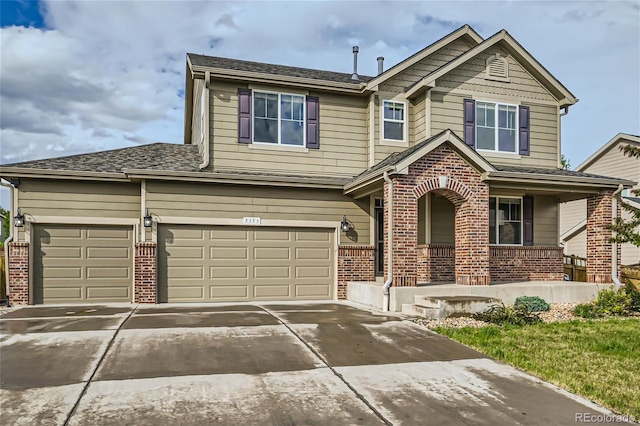 view of front of home with a garage and covered porch