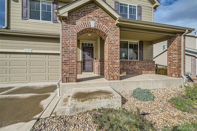 entrance to property featuring a porch