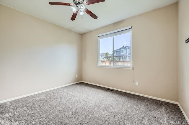 carpeted empty room featuring ceiling fan