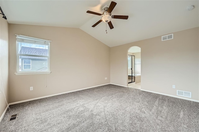 carpeted empty room with lofted ceiling and ceiling fan