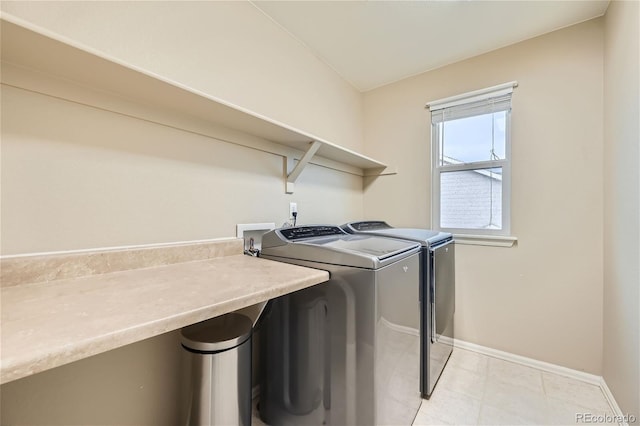 clothes washing area featuring washer and dryer