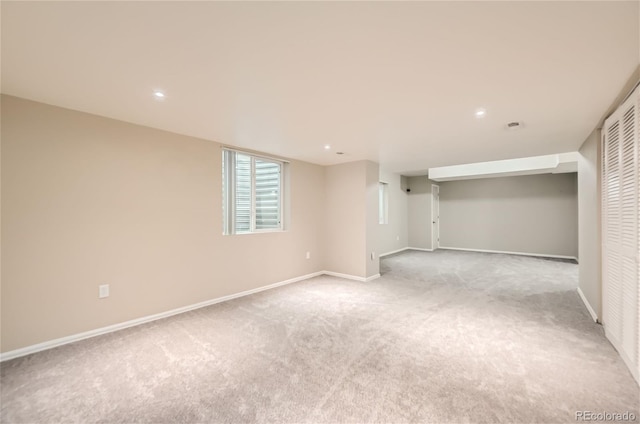 basement with light colored carpet