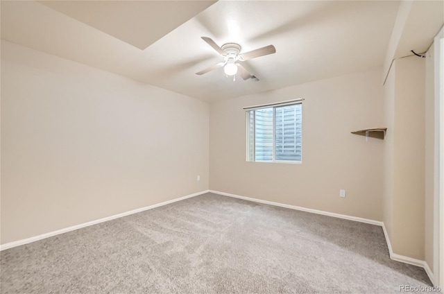 empty room featuring carpet floors and ceiling fan