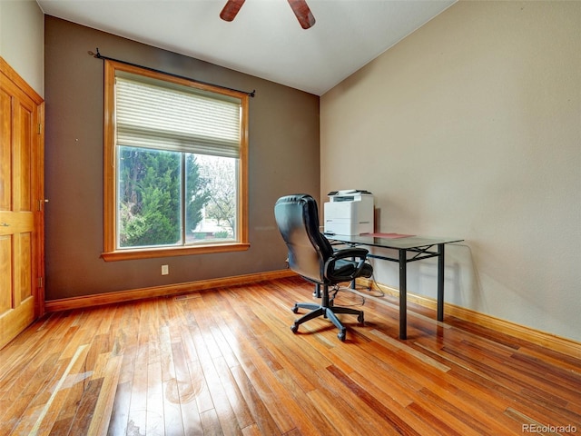 6533 S Quemoy Way, Aurora, CO 80016 - unfurnished office featuring a wealth of natural light, baseboards, ceiling fan, and light wood-type flooring
