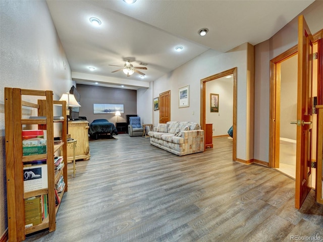 6533 S Quemoy Way, Aurora, CO 80016 - living area featuring wood finished floors and a ceiling fan