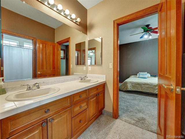 6533 S Quemoy Way, Aurora, CO 80016 - bathroom with a sink, ceiling fan, double vanity, and ensuite bathroom