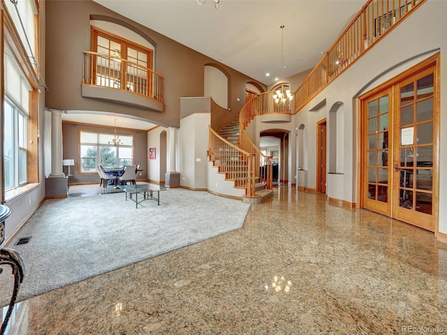 6533 S Quemoy Way, Aurora, CO 80016 - foyer entrance with a towering ceiling, baseboards, and granite finish floor