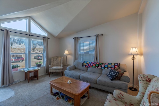 living room with vaulted ceiling, carpet flooring, and baseboards