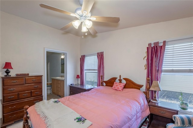 bedroom featuring connected bathroom and a ceiling fan