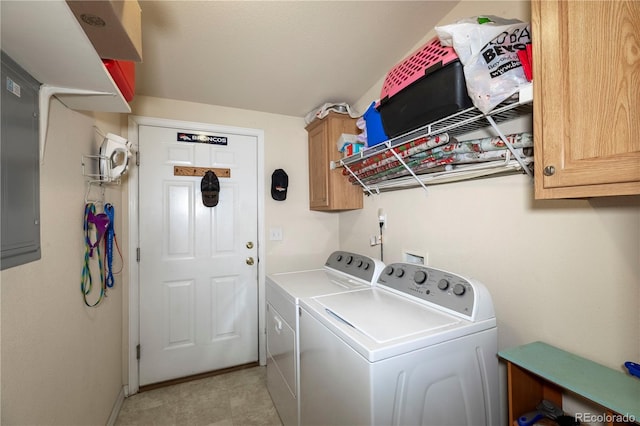 washroom with washer and dryer and cabinet space