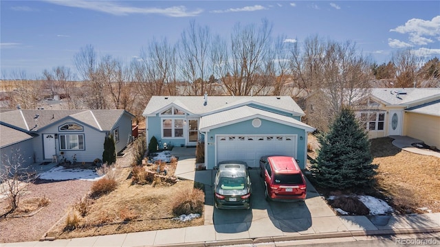 view of front of house with a garage and driveway