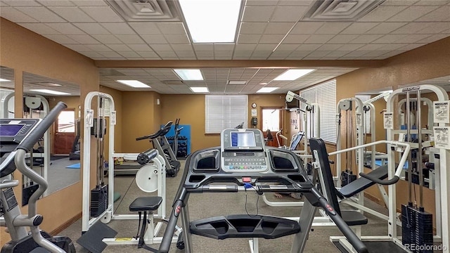 workout area featuring visible vents and a paneled ceiling