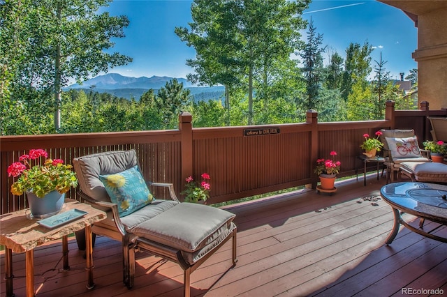 wooden terrace featuring a mountain view