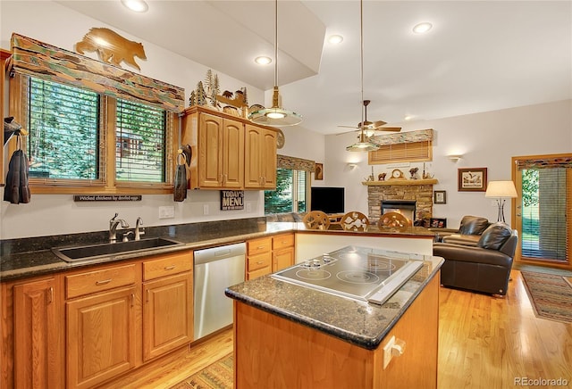 kitchen featuring a sink, open floor plan, ceiling fan, black electric stovetop, and stainless steel dishwasher