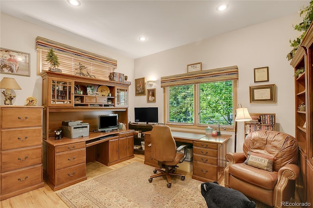 home office featuring built in desk, light wood-type flooring, and recessed lighting