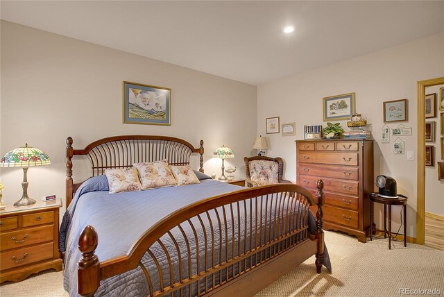 bedroom featuring baseboards, recessed lighting, and light carpet