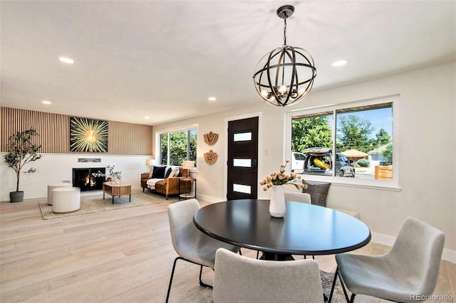 dining room featuring light hardwood / wood-style flooring and a chandelier