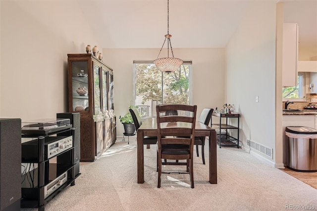 view of carpeted dining space