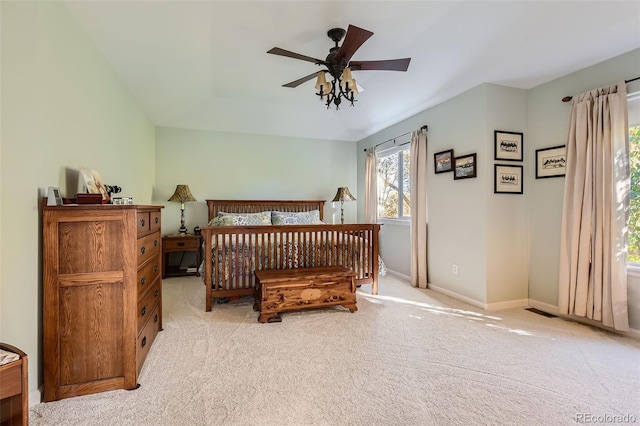 carpeted bedroom with lofted ceiling and ceiling fan