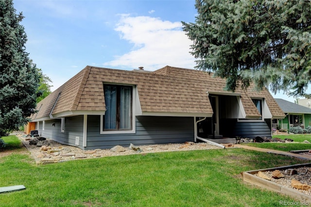 20 Scott Dr, Broomfield, CO 80020 - rear view of house featuring a lawn, a shingled roof, and mansard roof