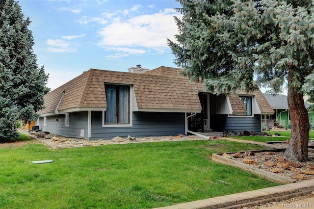 20 Scott Dr, Broomfield, CO 80020 - front facade with a front lawn, roof with shingles, and mansard roof