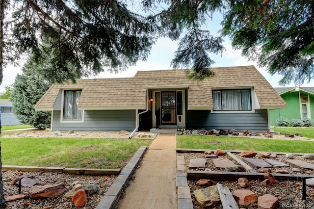 20 Scott Dr, Broomfield, CO 80020 - view of front of house with a front yard, roof with shingles, and a garden