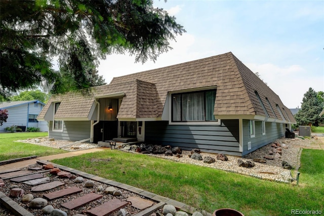 20 Scott Dr, Broomfield, CO 80020 - view of front of home featuring a front yard, a shingled roof, and cooling unit