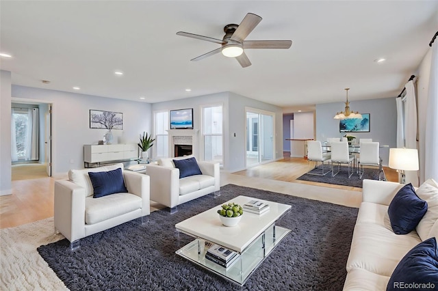 20 Scott Dr, Broomfield, CO 80020 - living area with wood finished floors, a ceiling fan, healthy amount of natural light, and recessed lighting