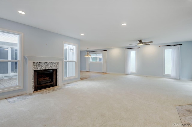 20 Scott Dr, Broomfield, CO 80020 - unfurnished living room with carpet flooring, a fireplace, recessed lighting, a ceiling fan, and a chandelier