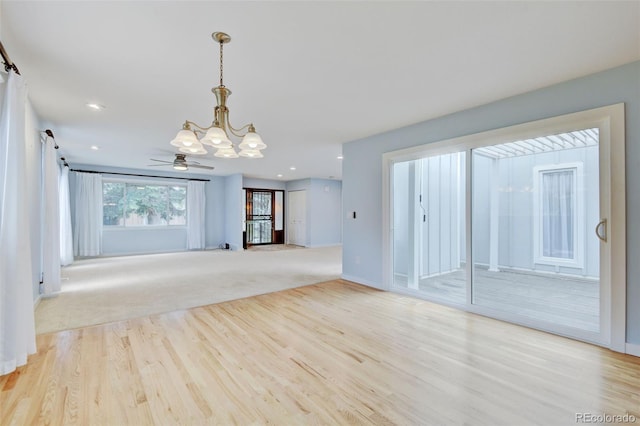 20 Scott Dr, Broomfield, CO 80020 - unfurnished living room featuring a chandelier, wood finished floors, baseboards, ceiling fan, and recessed lighting