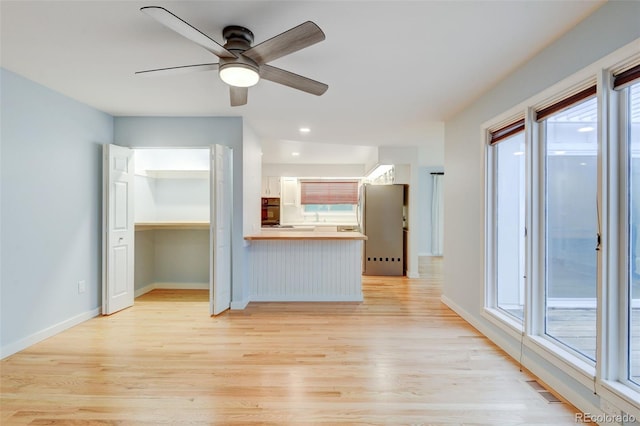 20 Scott Dr, Broomfield, CO 80020 - unfurnished living room with light wood-style floors, a ceiling fan, baseboards, and recessed lighting