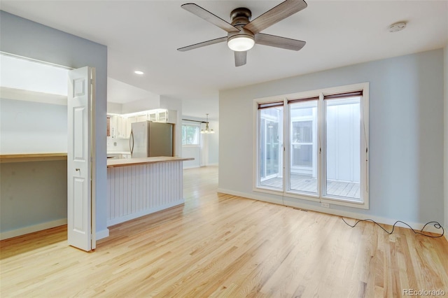 20 Scott Dr, Broomfield, CO 80020 - unfurnished living room with ceiling fan, light wood-type flooring, baseboards, and recessed lighting