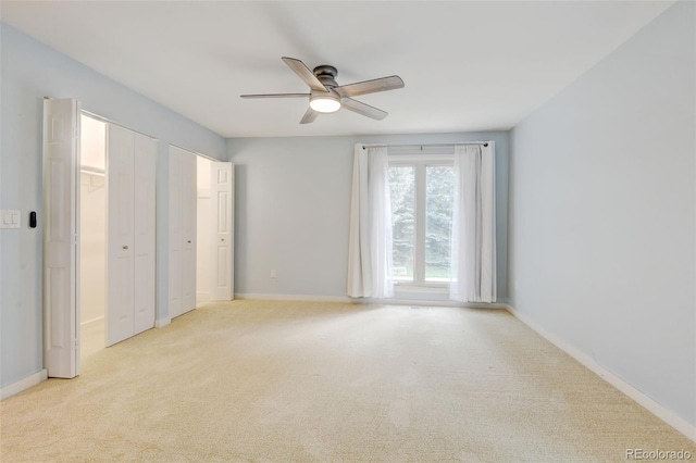 20 Scott Dr, Broomfield, CO 80020 - unfurnished bedroom featuring multiple closets, light carpet, baseboards, and a ceiling fan