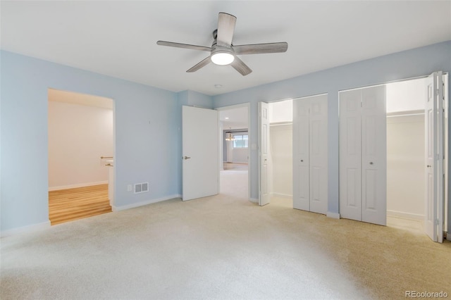 20 Scott Dr, Broomfield, CO 80020 - unfurnished bedroom with light carpet, multiple closets, ensuite bathroom, baseboards, and ceiling fan