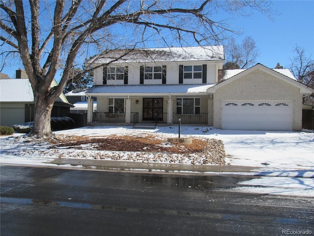 front of property with covered porch and a garage