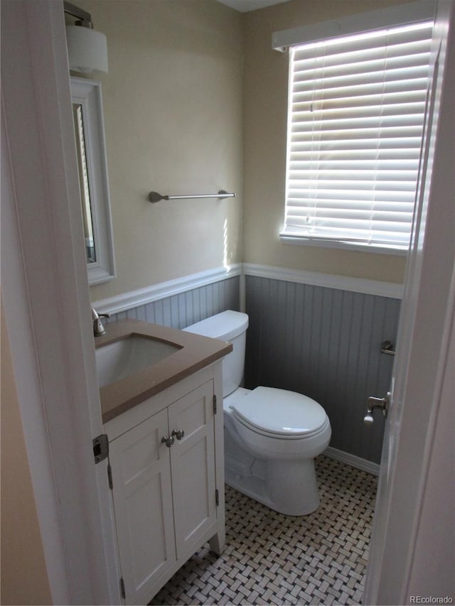 bathroom featuring toilet and vanity