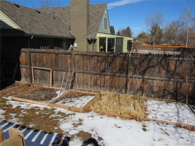 view of yard covered in snow