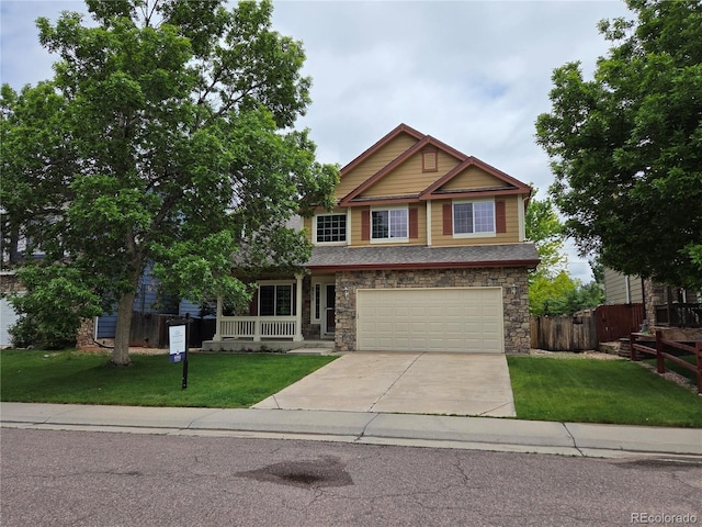 8772 S Carr Way, Littleton, CO 80128 - craftsman-style home with driveway, a porch, a garage, and stone siding