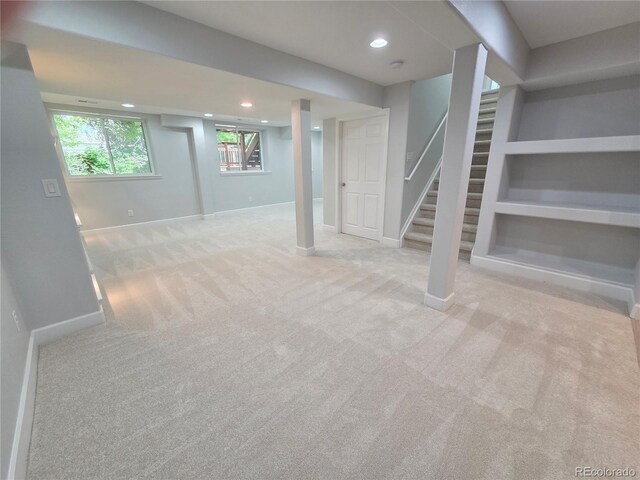 8772 S Carr Way, Littleton, CO 80128 - below grade area with carpet, recessed lighting, baseboards, and stairway