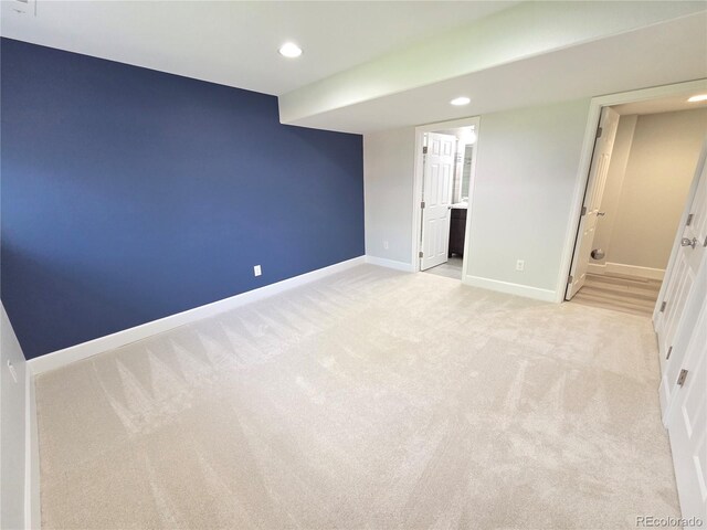 8772 S Carr Way, Littleton, CO 80128 - unfurnished bedroom with light carpet, recessed lighting, and ensuite bathroom