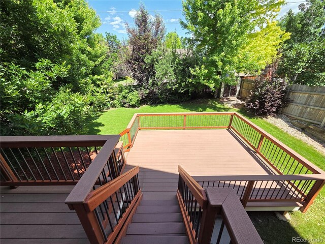8772 S Carr Way, Littleton, CO 80128 - wooden terrace featuring a fenced backyard