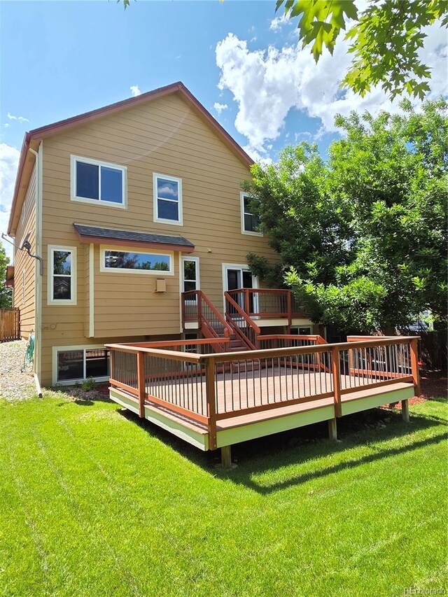 8772 S Carr Way, Littleton, CO 80128 - back of property with a wooden deck and a lawn