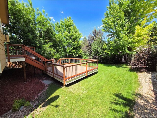 8772 S Carr Way, Littleton, CO 80128 - view of yard featuring a wooden deck
