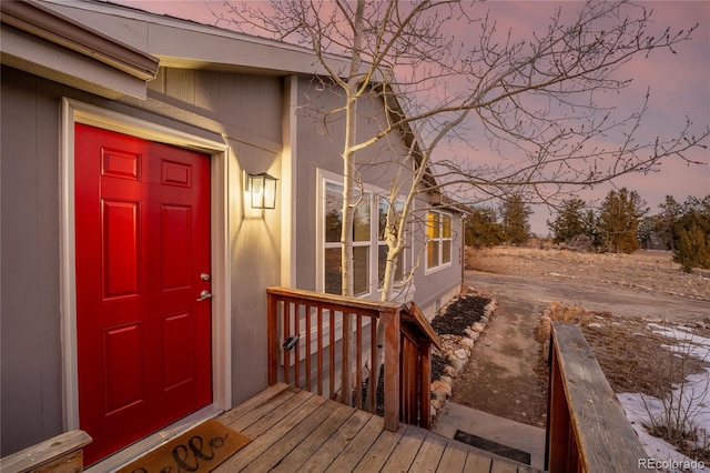 view of exterior entry at dusk