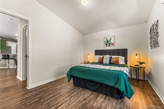 bedroom featuring dark hardwood / wood-style flooring