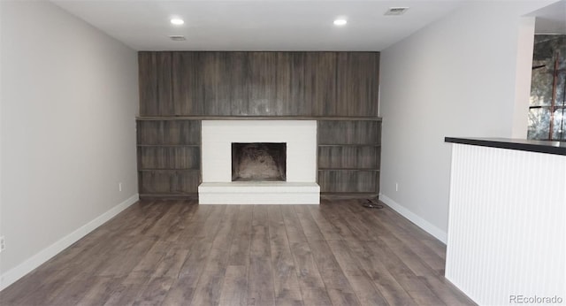 unfurnished living room with hardwood / wood-style floors